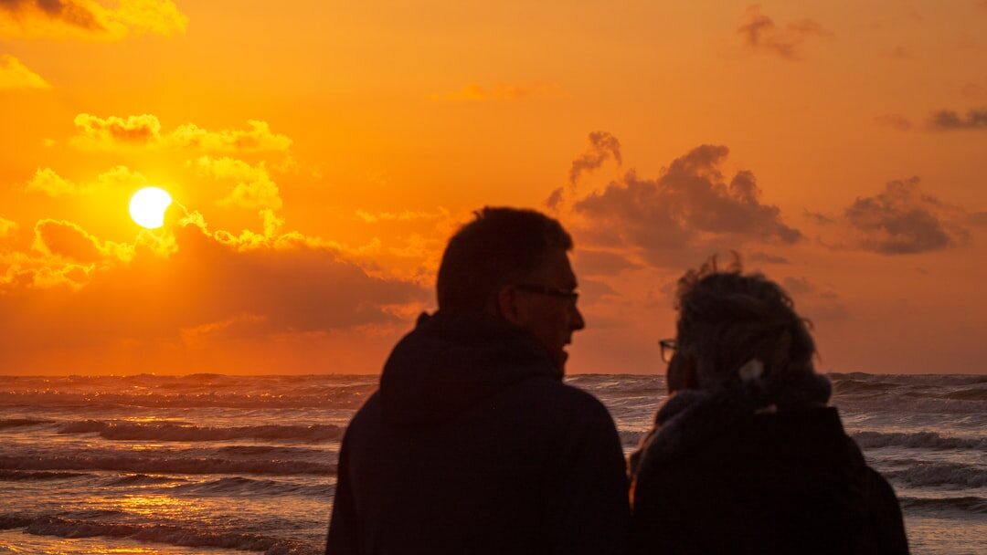senior couple enjoying sunset