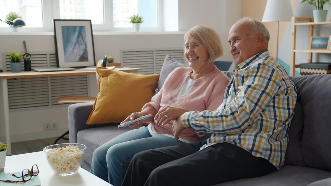 senior using tablet at home