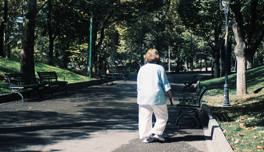 senior man walking in park