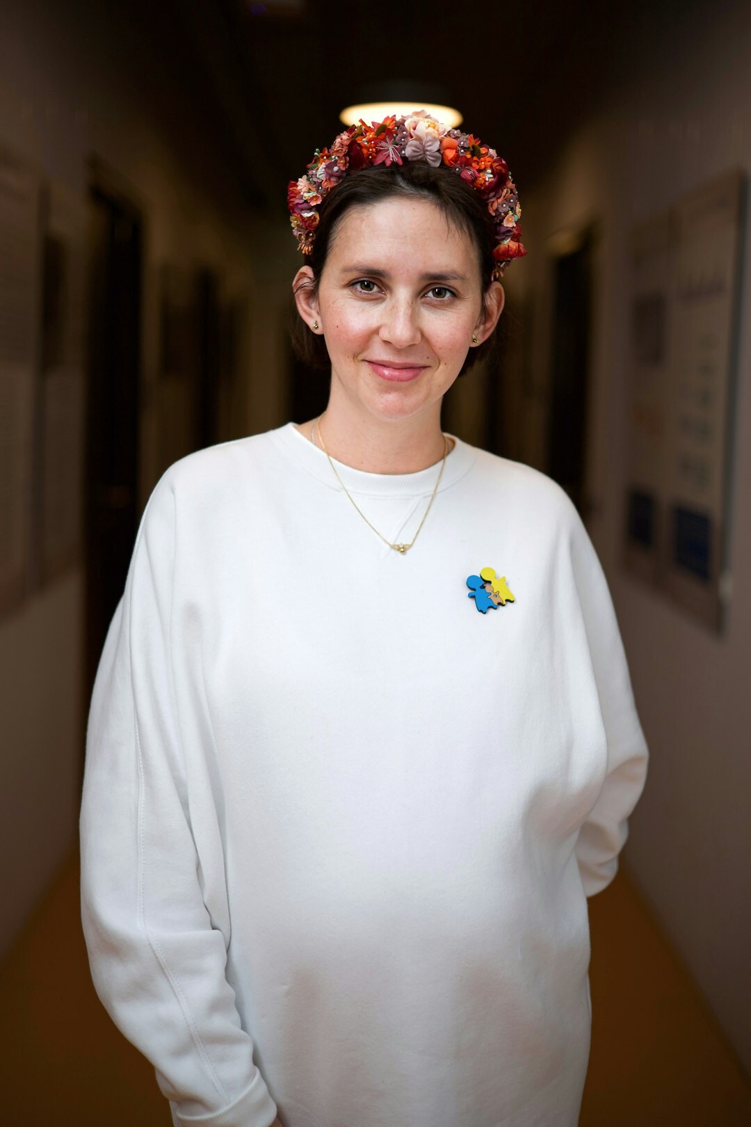 Studio portrait of a friendly middle-aged Croatian woman program coordinator